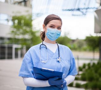 Healthcare professional in a long-term care facility wearing a mask