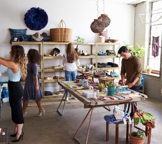 A photo of a boutique with shoppers looking around