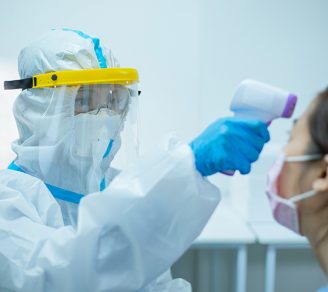 A health worker wearing PPE kit