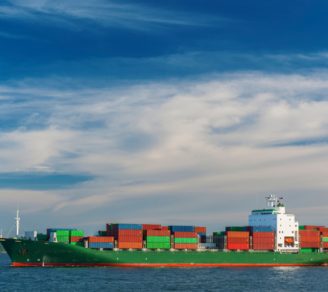 Overhead view of a freight ship depositing cargo
