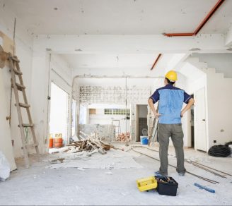 A home renovation contractor looking at a room to be renovated