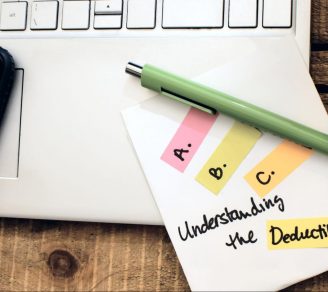 Close-up of a note on a laptop saying “Understanding the Deductible”