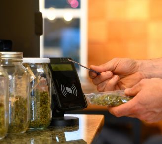 A customer purchasing cannabis using a credit card