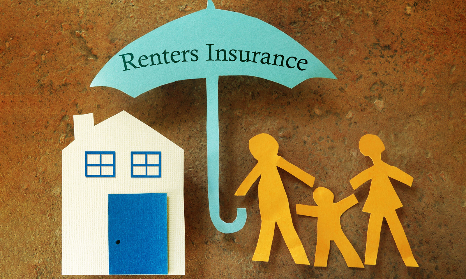 The words “renters insurance” written on a paper cut out of an umbrella.