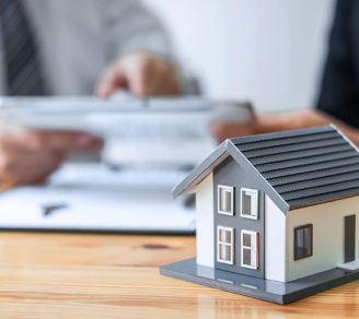 Two people discussing buildings insurance vs landlord insurance
