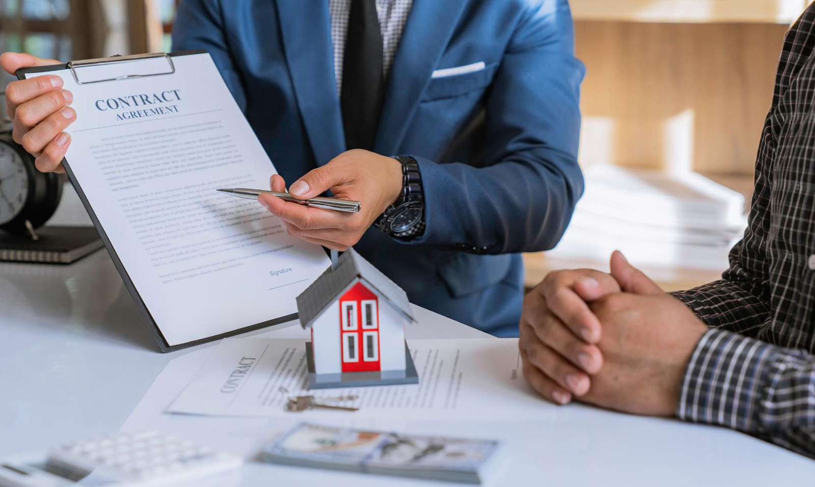 A business owner explaining contractor insurance coverage to a client