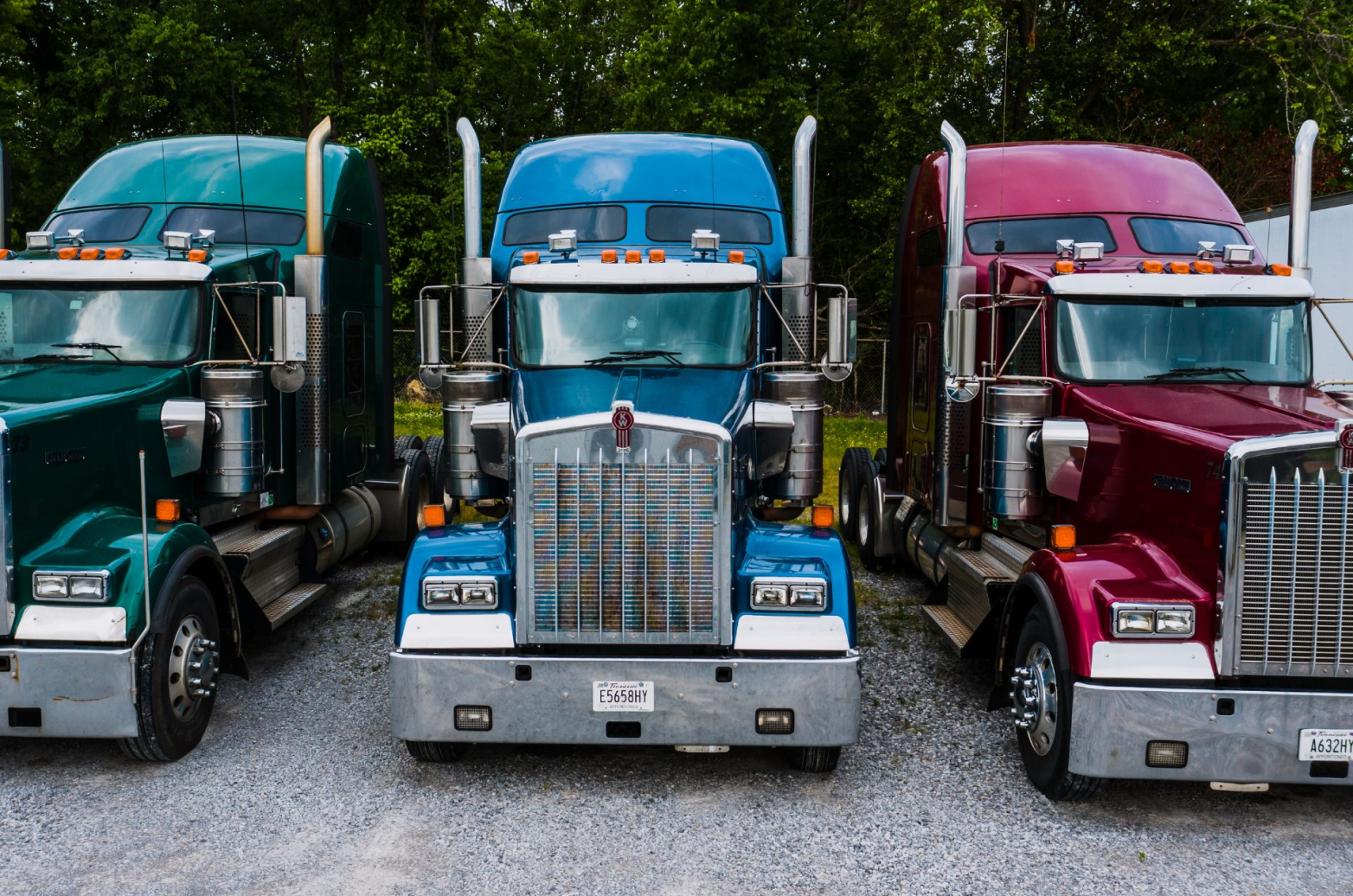 Three trucks parked together.