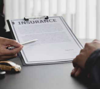 An insurance broker explaining to a client how their policy works