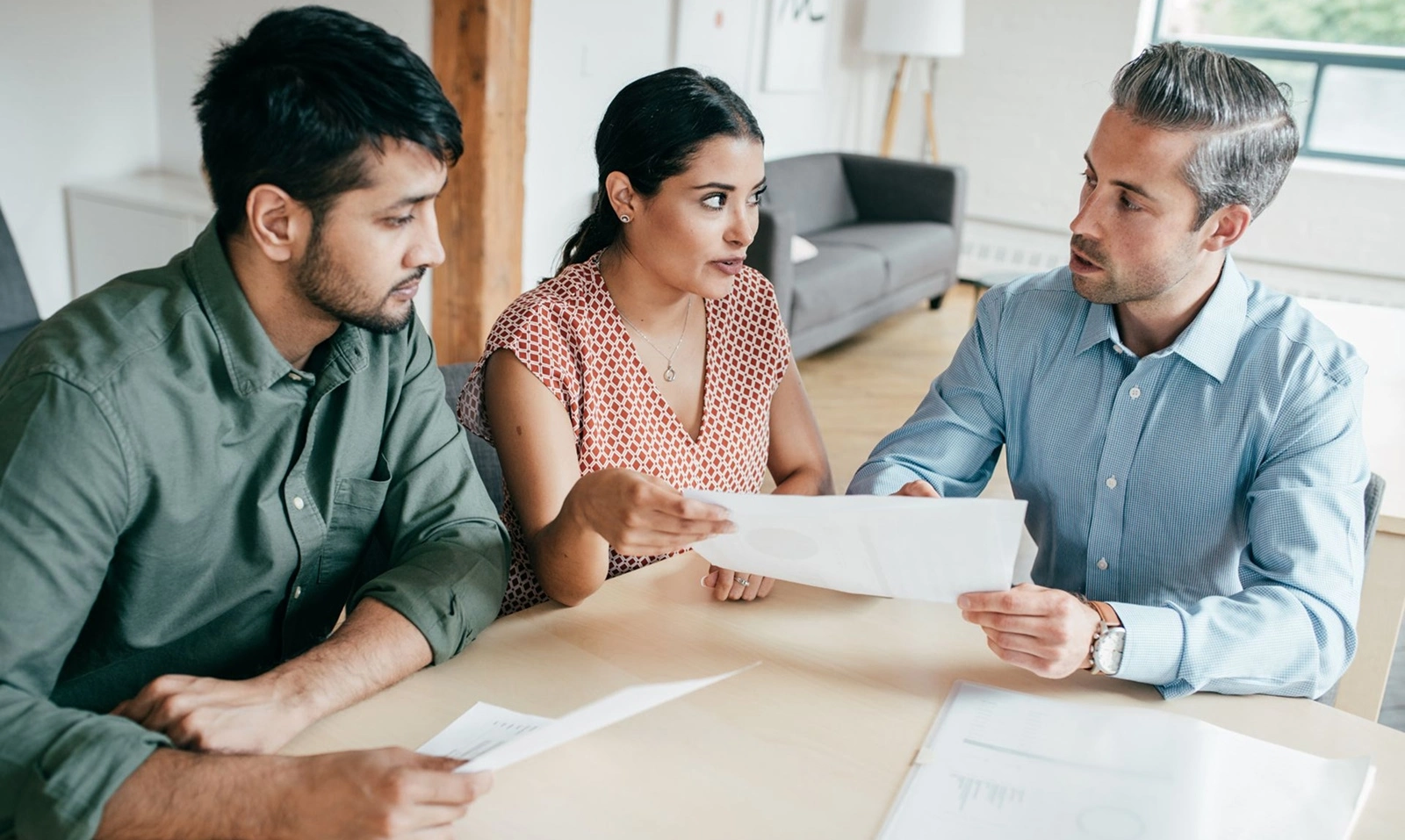 A couple meeting with an insurance broker